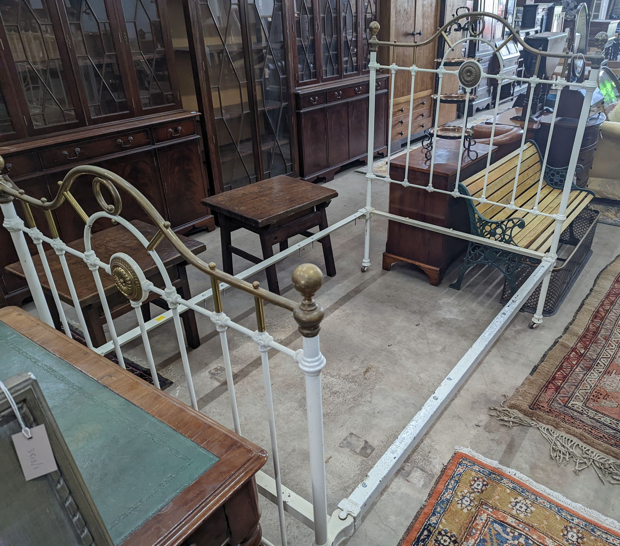 A Victorian painted iron and brass single bedframe, width 120cm, length 200cm